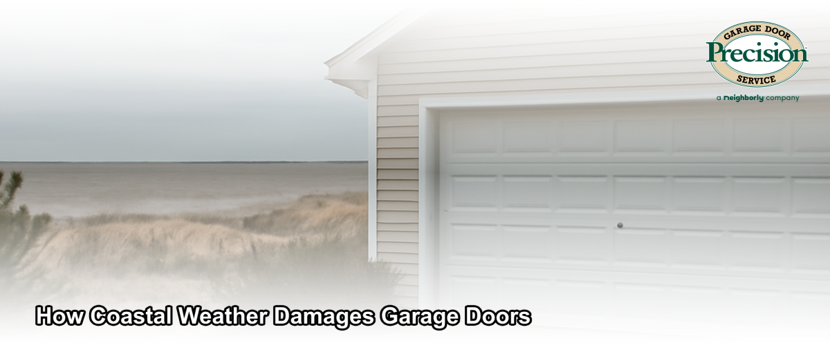 A residential garage door on a coastal New Jersey home near the ocean, showing signs of salt air exposure with a weathered exterior