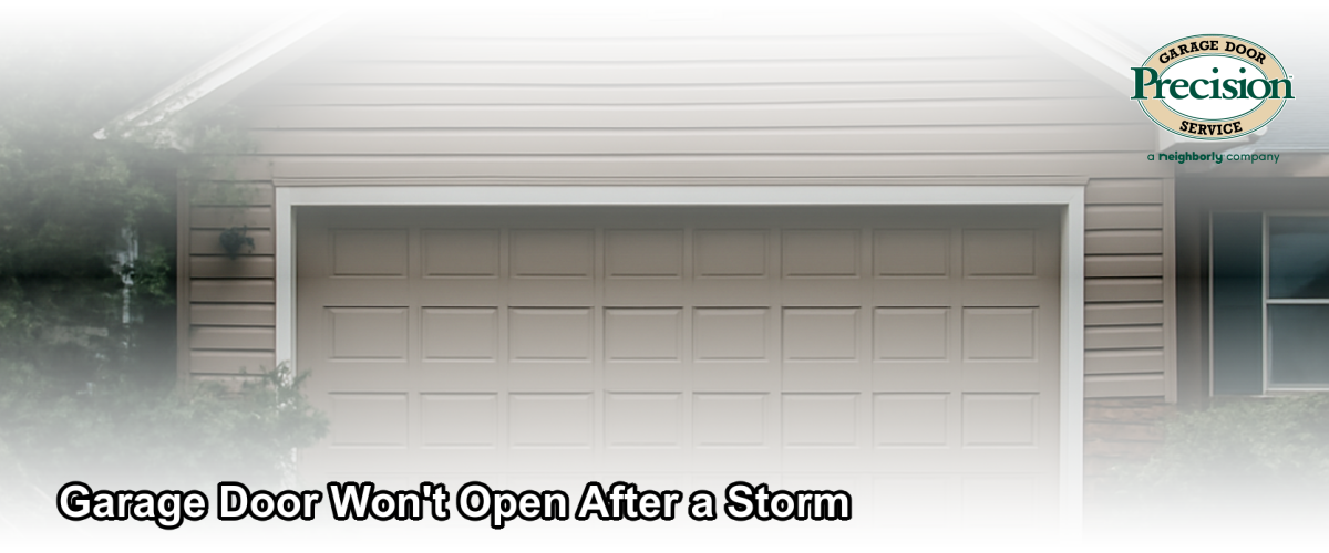 Storm-damaged garage door on a residential home in Central New Jersey with debris on the driveway after a severe weather event