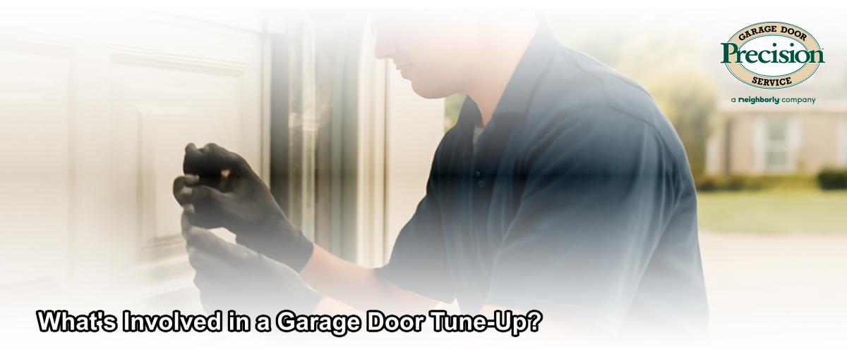 A garage door technician performing a professional tune-up and safety inspection on a residential garage door in Central New Jersey