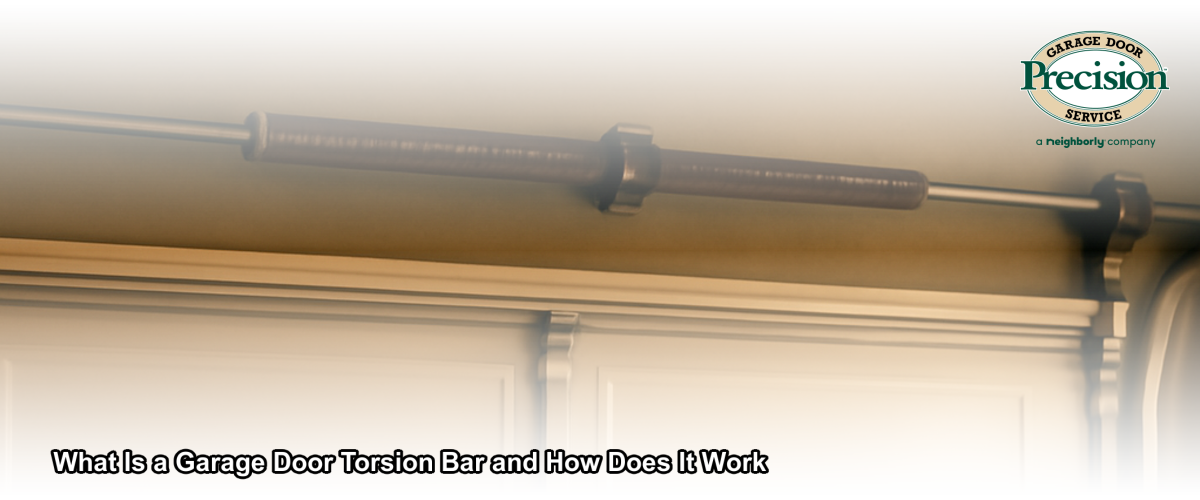 Close-up of a garage door torsion bar and spring assembly mounted above a residential garage door in New Jersey